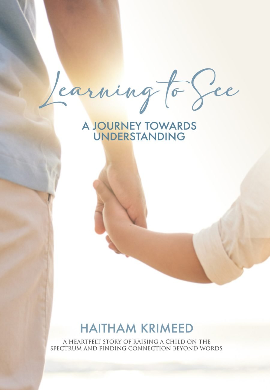 Cover of Learning to See: a father's hand holding a small child's hand in morning light
