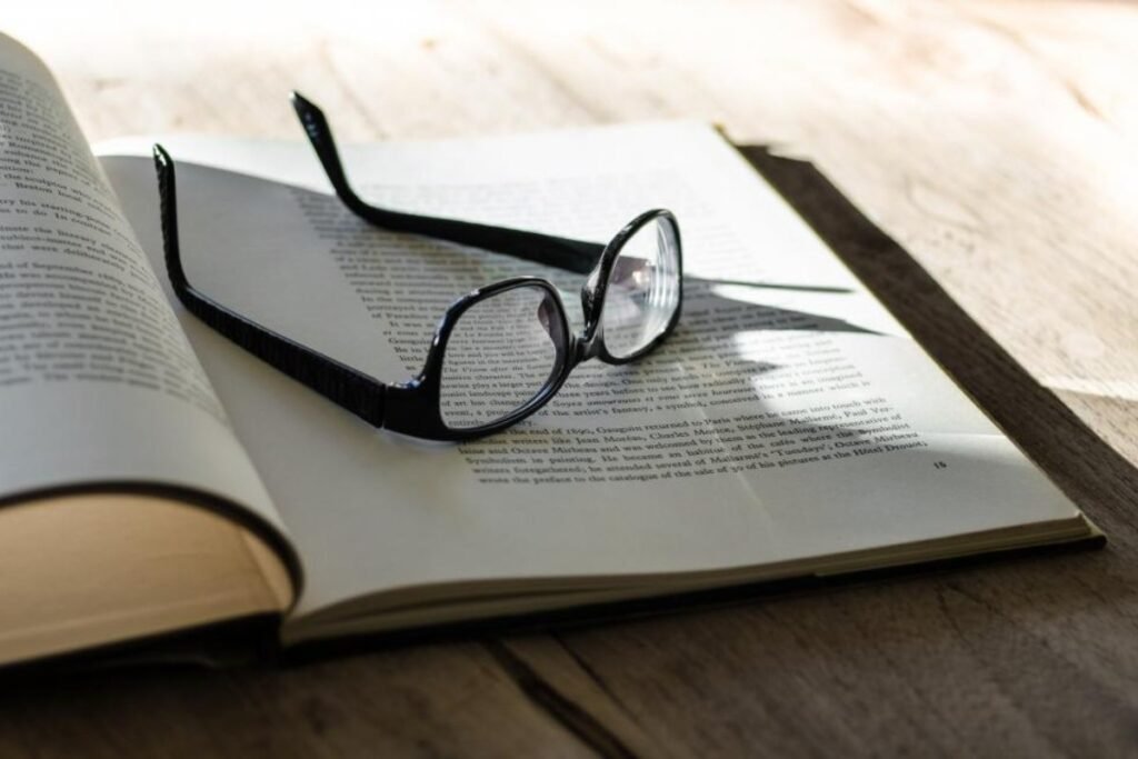 Eyeglasses resting on an open book